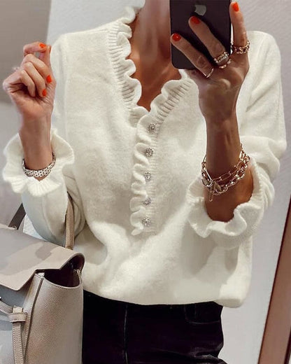 Fleur | Elegante trui met knopen in een effen kleur