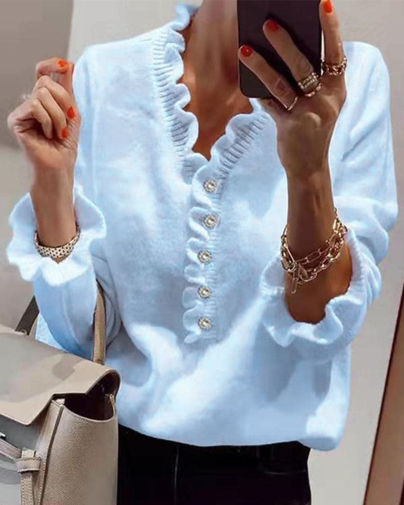 Fleur | Elegante trui met knopen in een effen kleur